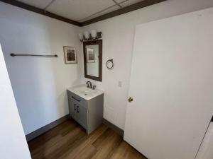 a bathroom with a sink and a mirror at Athens House number 7B in Las Vegas