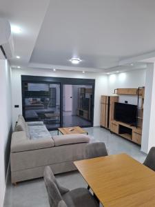 a living room with a couch and a table at Casa Lavinia in Bregvija