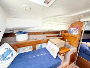 a small room in a boat with a bed at Nuit insolite voilier in Le Havre +6 photos