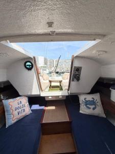 a view from the inside of a boat with pillows at Nuit insolite voilier in Le Havre