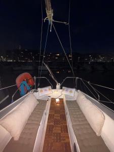 a boat with pillows on the deck at night at Nuit insolite voilier in Le Havre
