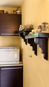 a kitchen with wooden shelves on the wall at Premium Villa Tode in Bansko +54 photos