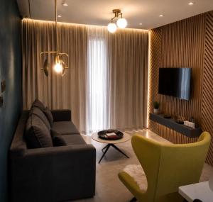 a living room with a couch and a table at Kay-Stay in Larnaca