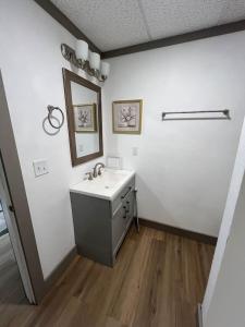 a bathroom with a sink and a mirror at Athens House nuber 8 in Las Vegas