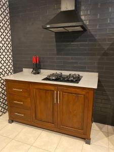 a kitchen with a stove and a counter top at Ntaba Villas in Port St. Johns