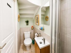 a small bathroom with a toilet and a sink at Quai du Val is a Charming Pet and Family Friendly Riverside Gite in Lehon close to Dinan Sleeps 7 in Dinan +49 photos