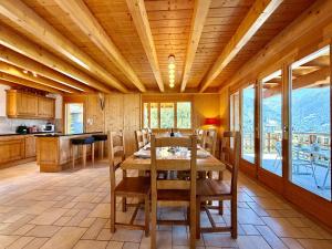 a kitchen and dining room with a table and chairs at Tschoueilles 009 MOUNTAIN & VIEW - chalet 12 pers in Veysonnaz