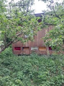 a wooden fence in the middle of some trees at Api terapia Bojnice in Bojnice