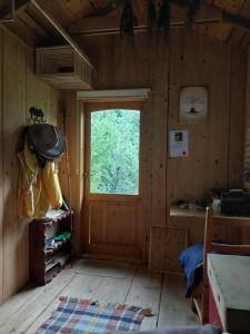 a room with a door and a window in a cabin at Api terapia Bojnice in Bojnice