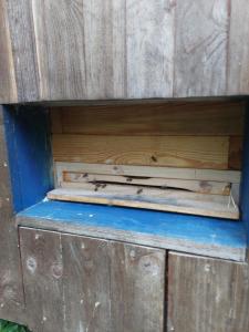 a wooden drawer in a wooden box with a blue bottom at Api terapia Bojnice in Bojnice