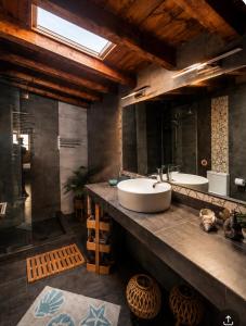 a bathroom with two sinks and a large mirror at Sea La Vie in Keramídhion +40 photos