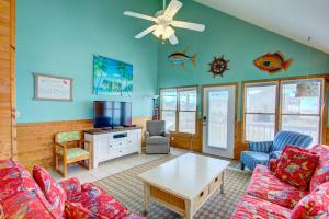a living room with a couch and a table at 4073 - Downtime in Kitty Hawk
