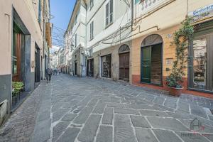 a cobblestone street in an alley between buildings at SeaSoul - Mare 100m - 6 Guests - Centro Storico in Albissola Marina