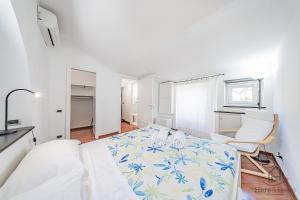 a bedroom with a bed and a desk and a chair at SeaSoul - Mare 100m - 6 Guests - Centro Storico in Albissola Marina