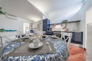 a kitchen and dining room with a table and chairs at SeaSoul - Mare 100m - 6 Guests - Centro Storico in Albissola Marina +20 photos