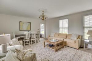 a living room with a couch and a table at Waterfront Home with Large Yard, Dock & Bay View in Heathsville