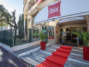 a red carpet in front of a store at ibis Cannes Plage La Bocca in Cannes