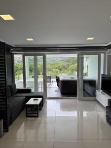 a living room with a couch and a television at Villa San Antonio in Baška