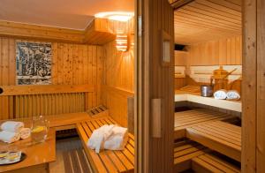 a sauna with a table and towels at Hotel Astoria Bonn in Bonn +29 photos