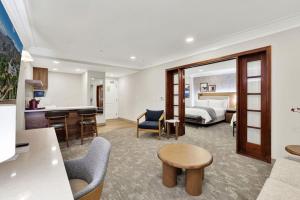 a hotel suite with a bed and a living room at Best Western Plus Sunset Plaza Hotel in Los Angeles +40 photos