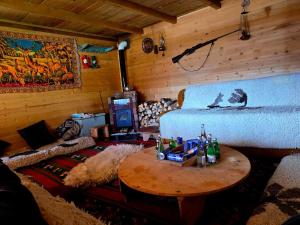 a room with a bed and a table with bottles on it at Ivovik in Rožaje