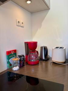a kitchen counter with a blender on top of it at Le Cocon de Clisson in Clisson