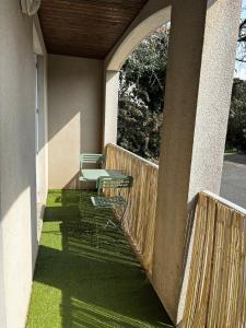 a balcony with a table and chairs on it at Le Cocon de Clisson in Clisson