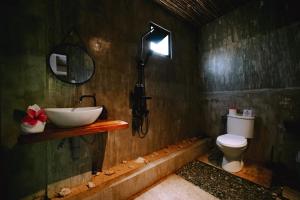 a bathroom with a sink and a toilet at Casa Felipe in General Luna