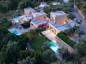 an aerial view of a house with a swimming pool at Atrium Villas in Kechria