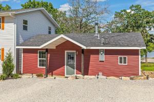 a red house with a white house at Red House - Lake Views - Outdoor Pool in Kimberling City