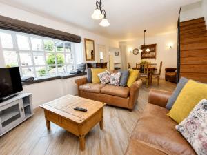 a living room with two couches and a tv at Bowland Breaks - Cobble View Cottage Cosy Retreat, Parking, Near Wedding Venues, Village Location with 3 great pubs in Waddington