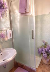 a bathroom with a shower and a sink at Casa Augusta in Maccagno Superiore +34 photos