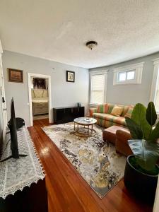 a living room with a couch and a table at Hillside Appartment #2 in Newark