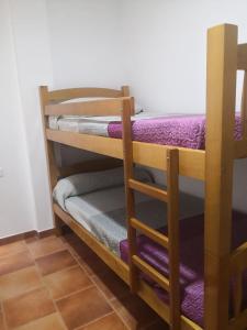a couple of bunk beds in a room at ESCAPADA RELAX in Arroyo Frio +22 photos