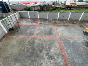 a view of a concrete patio with a white fence at Chase hotels in Ibadan