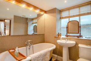a bathroom with a tub and a sink at 2 Bed in Hexham oc-88032 in Bardon Mill +26 photos