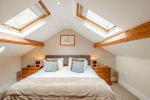 a bedroom with a bed and skylights at 2 Bed in Hexham oc-88032 in Bardon Mill