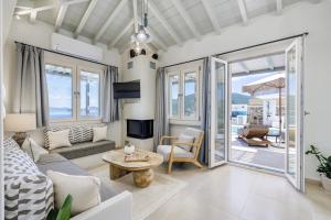 a living room with a couch and a table at Villa Aerys in Skopelos Town