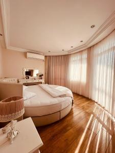 a bedroom with a bed and a desk and a mirror at Buyukada Princess Hotel in Buyukada +50 photos