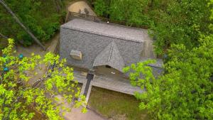 an overhead view of a building in the trees at Tree-Top Chalet in Logan