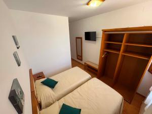 a small room with a bed and a bunk bed at Casa Rural Tronchon in Tronchón +34 photos