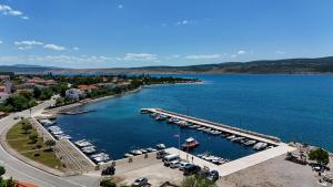 an aerial view of a marina with boats in the water at Vila Velebita in Seline