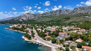 a small town with a bridge over a body of water at Vila Velebita in Seline