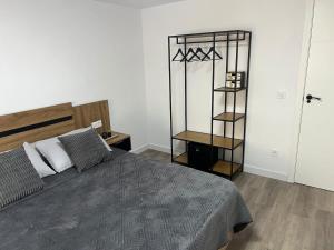 a bedroom with a bed and a mirror on the wall at Apartment in Amer in Amer