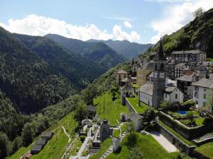 an aerial view of a village in the mountains at Casa Onsernone in Comologno in Comologno