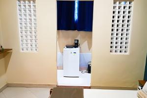 a water heater in a room with a window at Casa Marajoara in Soure +24 photos