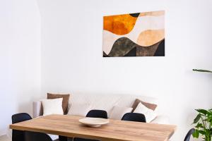 a living room with a table and a couch at La casina - YourPlace Abruzzo in Fossacesia