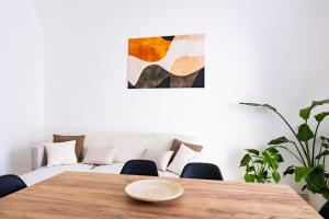 a dining room with a table and a couch at La casina - YourPlace Abruzzo in Fossacesia +25 photos