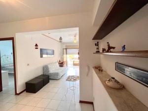 a living room with a couch and a fireplace at Casa marina in Furci Siculo