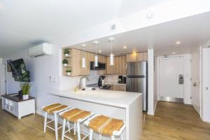 a kitchen with a white counter and a refrigerator at Ilikai Tower 525 in Honolulu +31 photos